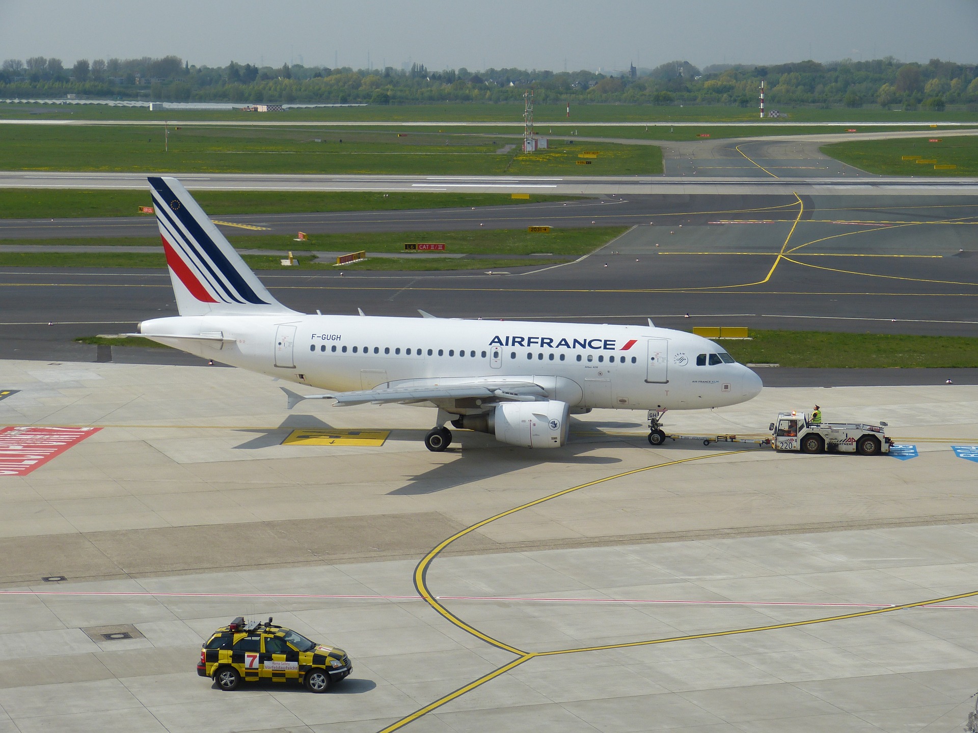 aircraft pulled by a towbar tug